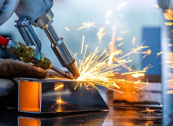 Close up of welder in a factory welding steel bars